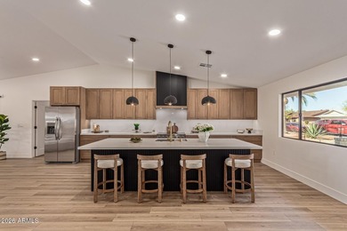 E X Q U I S I T E Golf Course Residence. Inside, you'll find a