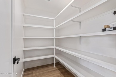 E X Q U I S I T E Golf Course Residence. Inside, you'll find a