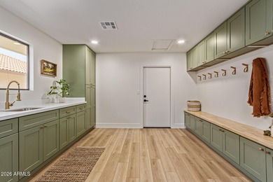 E X Q U I S I T E Golf Course Residence. Inside, you'll find a