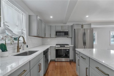 Nestled in the heart of Oakland Beach, this newly renovated - photo 1