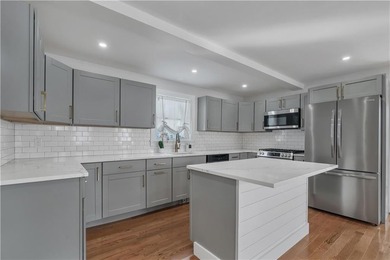 Nestled in the heart of Oakland Beach, this newly renovated - photo 2
