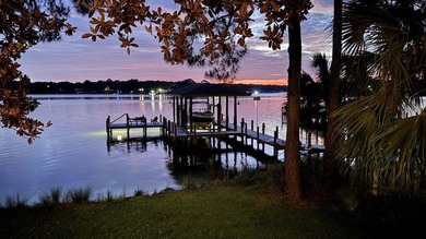 Positioned on a private one-acre homesite with 130 feet of deep - photo 1