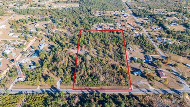 This large, vacant land parcel is a dream at 7.15 ACRES! Zoning - photo 2