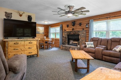 Escape to the mountains in this custom log cabin located in the - photo 4