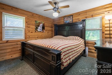 Escape to the mountains in this custom log cabin located in the - photo 9