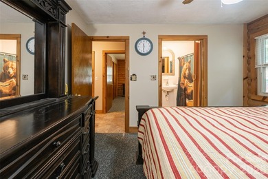 Escape to the mountains in this custom log cabin located in the - photo 10