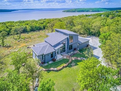 PANORAMIC LAKE VIEWS + TRUE LAKE LIFE LIVING! Discover elevated - photo 1