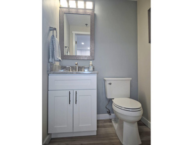 Experience coastal living at its finest in magnificently updated