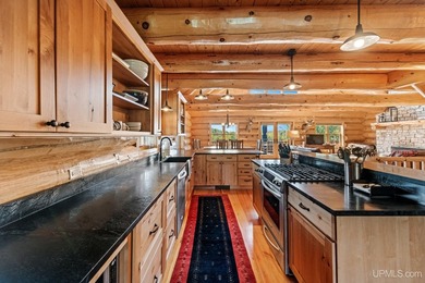 Escape to your own private paradise in this stunning log home - photo 10