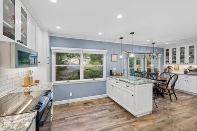 The brick driveway and lovely porch welcome you to this turnkey - photo 13