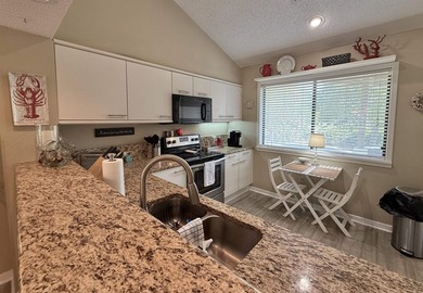 Updated and attractive second-floor end-unit villa featuring two - photo 21