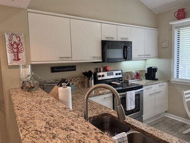 Updated and attractive second-floor end-unit villa featuring two - photo 22