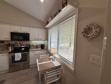 Updated and attractive second-floor end-unit villa featuring two - photo 24