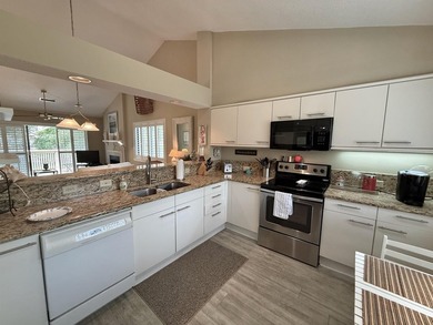 Updated and attractive second-floor end-unit villa featuring two - photo 25