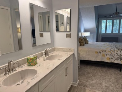 Updated and attractive second-floor end-unit villa featuring two - photo 37