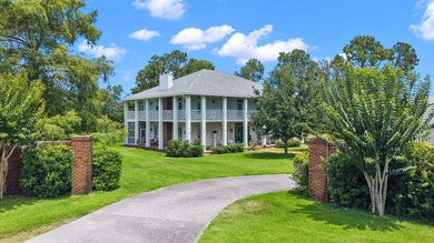 Tucked behind the gates of Bay Point, a grand Southern, Colonial - photo 1