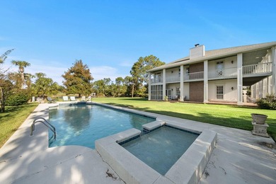 Tucked behind the gates of Bay Point, a grand Southern, Colonial - photo 2