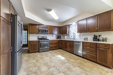 This customized and well-maintained 2-story home rests on a - photo 11