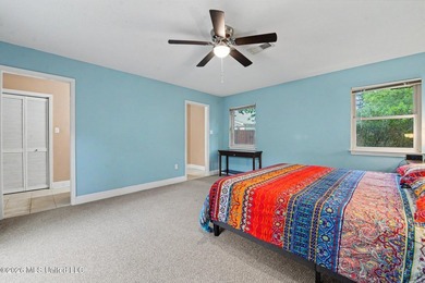 Situated on a quiet cul-de-sac in the heart of Diamondhead, this - photo 12