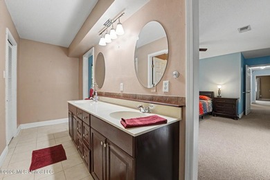 Situated on a quiet cul-de-sac in the heart of Diamondhead, this - photo 13