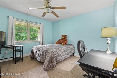 Situated on a quiet cul-de-sac in the heart of Diamondhead, this - photo 16