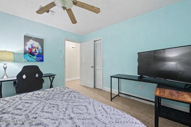Situated on a quiet cul-de-sac in the heart of Diamondhead, this - photo 17