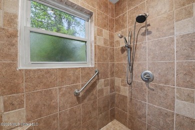 Situated on a quiet cul-de-sac in the heart of Diamondhead, this - photo 21