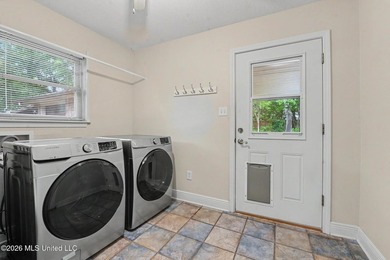 Situated on a quiet cul-de-sac in the heart of Diamondhead, this - photo 22