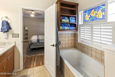 Nestled beneath majestic live oaks on Oak Island's sought-after - photo 31