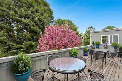 Light-filled and inviting, this upper-level residence at East - photo 13