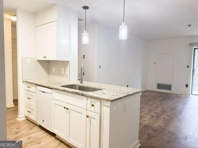 Welcome to this beautiful 3rd-floor condo in the prestigious 55+