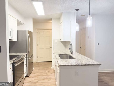 Welcome to this beautiful 3rd-floor condo in the prestigious 55+