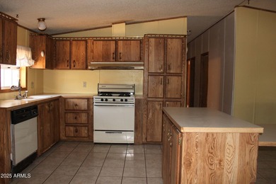 What a find...stucco 4BR/2BA home on 4 acres...covered front