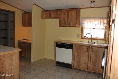 What a find...stucco 4BR/2BA home on 4 acres...covered front