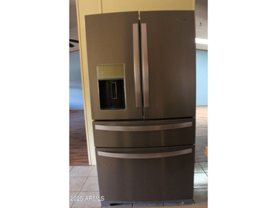 What a find...stucco 4BR/2BA home on 4 acres...covered front