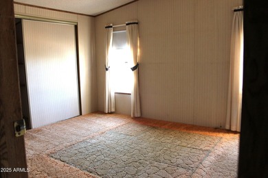 What a find...stucco 4BR/2BA home on 4 acres...covered front