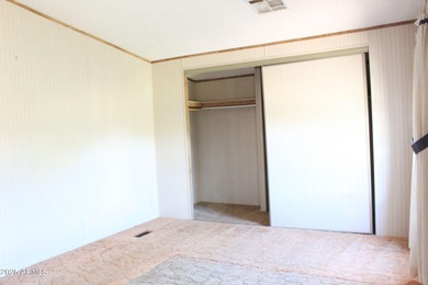 What a find...stucco 4BR/2BA home on 4 acres...covered front