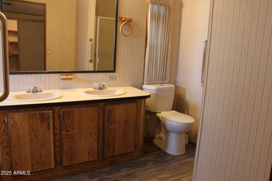 What a find...stucco 4BR/2BA home on 4 acres...covered front