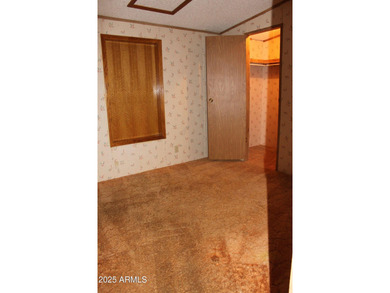 What a find...stucco 4BR/2BA home on 4 acres...covered front