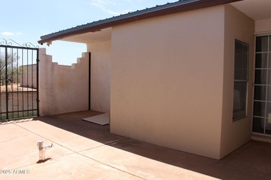 What a find...stucco 4BR/2BA home on 4 acres...covered front