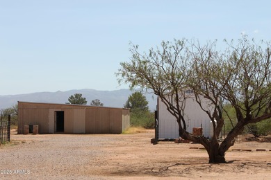 What a find...stucco 4BR/2BA home on 4 acres...covered front