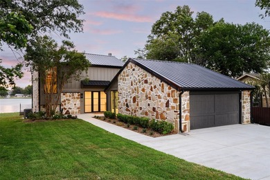 Experience elevated waterfront living at 313 Scenic Drive, where - photo 1