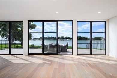 Experience elevated waterfront living at 313 Scenic Drive, where - photo 7