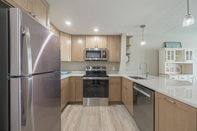 TOTALLY REDONE! ALL ASSESSMENTS PAID! This gorgeous condo has