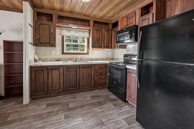 Located on the shores of beautiful Lake Higginbotham in - photo 11