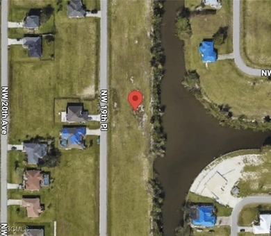 This OVERSIZED vacant lot offers a beautiful canal waterfront - photo 3
