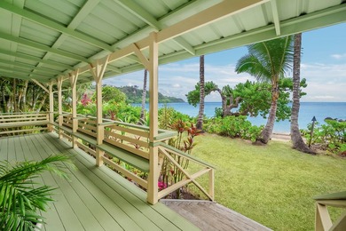 Set just a few feet from the gentle waters of Anini Beach, this - photo 20