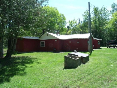 Looking for an Up North waterfront getaway with potential? This - photo 29