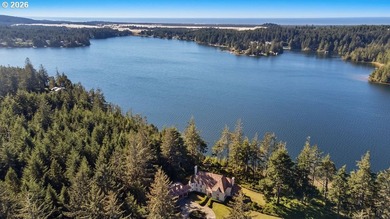Tucked away on 20.29 lush waterfront acres with 1,358 feet of - photo 2