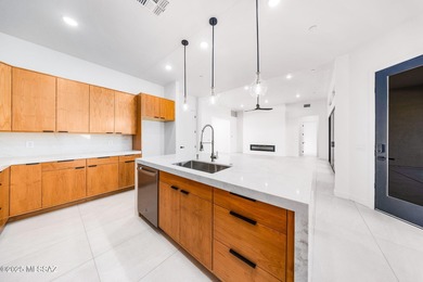 A shining new home in the Catalina Foothills. Located within